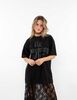 Polera Oversized Con Estampado Manga Corta Mujer Icono