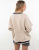 Polerón Oversized Con Estampado Mujer Icono